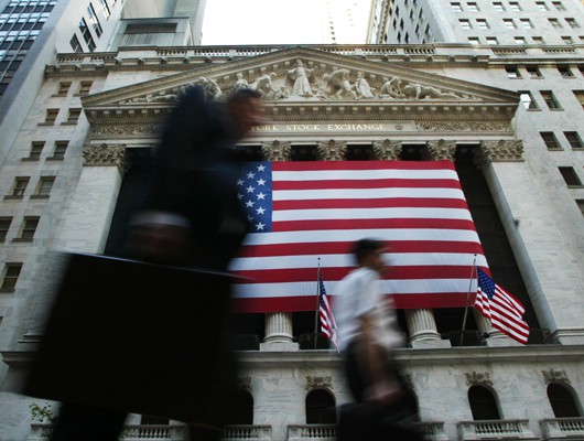 men walking in front of Stock Exchange building