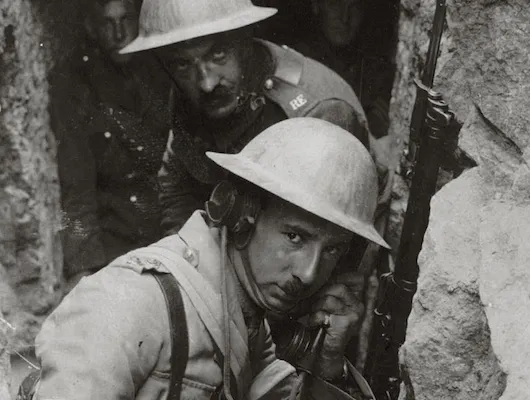 Soldiers hunkering down in a trench