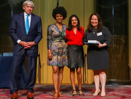 Staff members from The New York Times (from left: Selam Gebrekidan, Apoorva Mandavilli, Danielle Ivory) accept the 2021 Pulitzer Prize for Public Service from Columbia University President Lee Bollinger. (Jose Lopez/The Pulitzer Prizes)