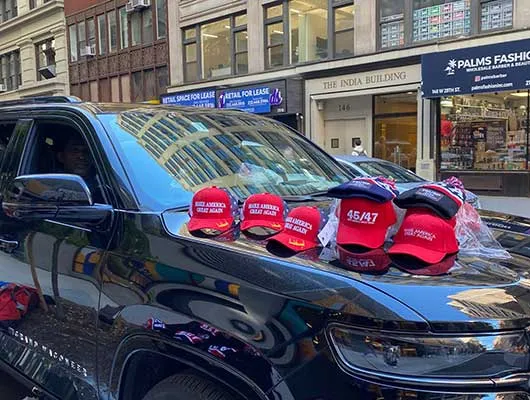 Campaign hats on a car hood in New York City