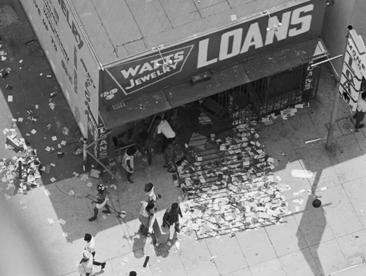 Aerial photo of people outside a looted store following the Watts Riots of 1968