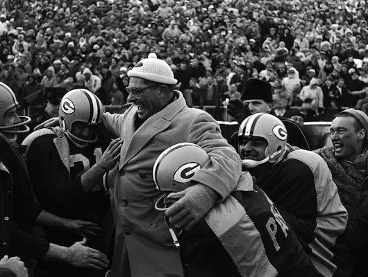 Packers celebrating a victory with coach Vince Lombardi