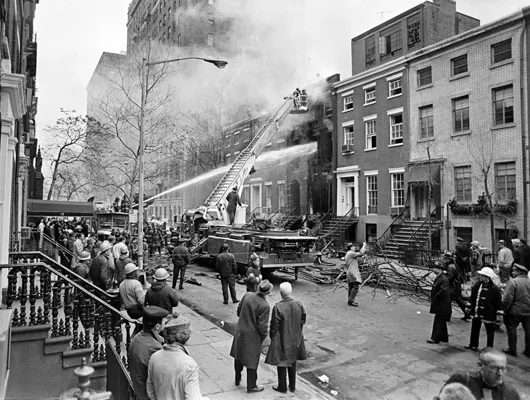 Firefighters at a blaze following an explosion at a Greenwich Village house