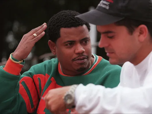 two men gesturing in conversation