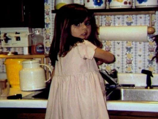 Photo of child washing dishes