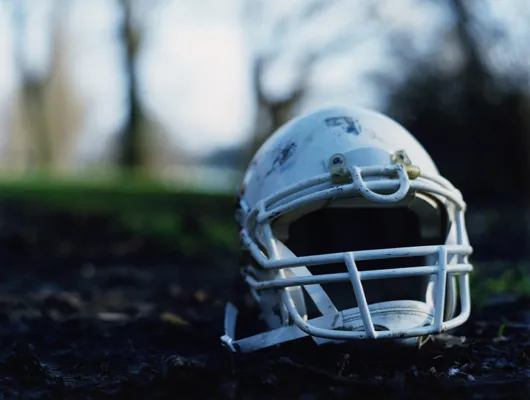 photo of football helmet on the ground