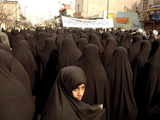 Women in burkas in large group on Tehran street