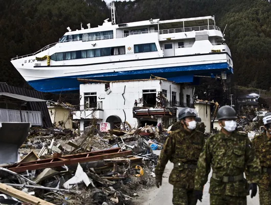 Boat sits on dry land after earthquake and sunami in Japan.